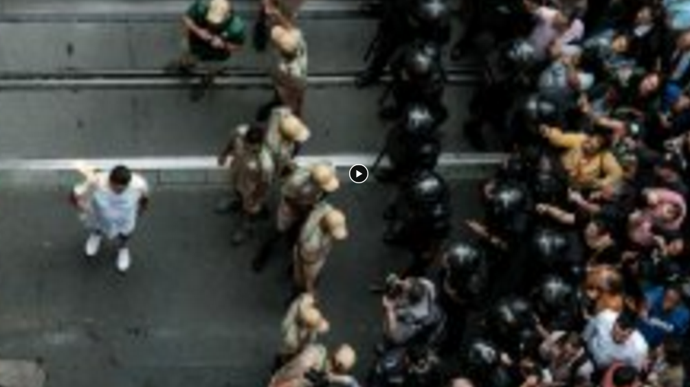 Police and protesters clash as Olympic torch passes through Rio
