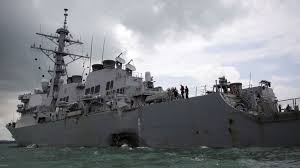 Ten missing after US destroyer collides with oil tanker