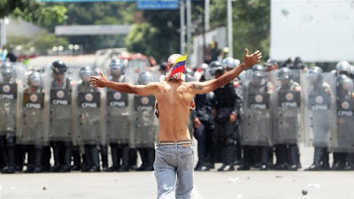 Venezuelans vow to carry on protests as clashes turn deadly