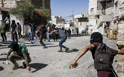 As raids on occupied ‘Issawiya escalate, Israelis arrest a Palestinian mother to pressure her son to turn himself in